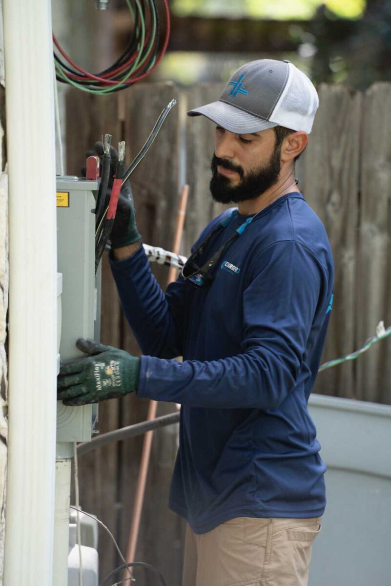 Charge Pro Texas electrician installing a transferswitch for a whole home backup generator 