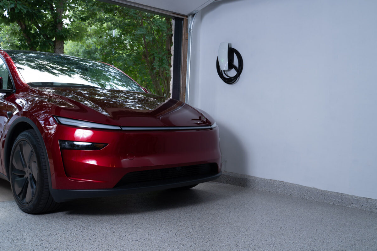 Tesla right next to wall charger in garage 