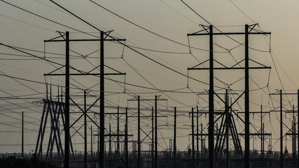 Why the Texas Grid Is Struggling a picture of power lines in texas