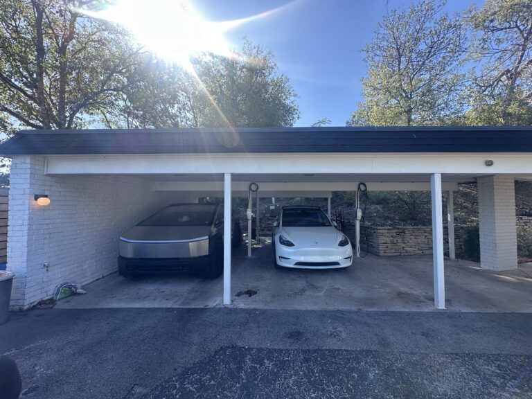 Carport with a Tesla Cybertruck and Model Y, each with its own Tesla Wall Connector
