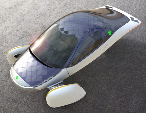 Aptera solar electric vehicle: sleek white three-wheeled EV with full-body hexagonal solar panel array under a panoramic glass canopy, aerodynamic teardrop design, green Aptera logos. Futuristic render.