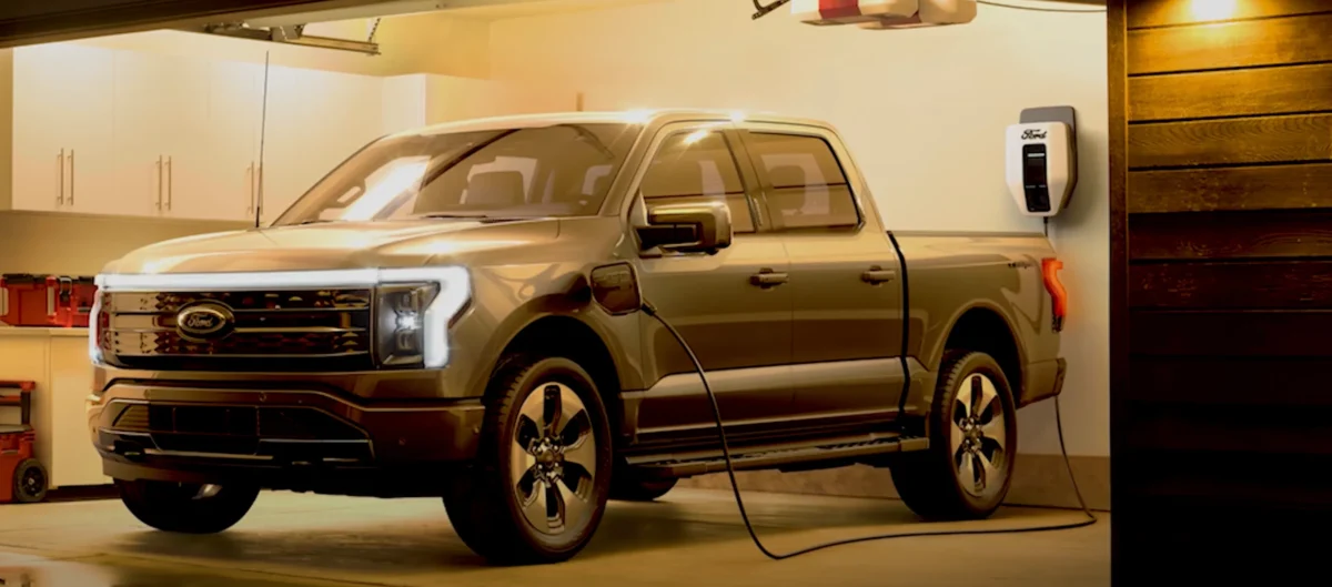 Ford F-150 Lightning using bidirectional Intelligent Backup Power. A Ford F-150 Lightning electric pickup, connected to a Ford Charge Station Pro, automatically activates bidirectional charging to supply seamless whole-home backup power during an outage via vehicle-to-home (V2H) technology.