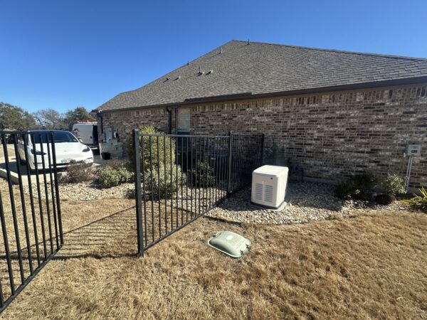 home standby generator installation in backyard near electrical service