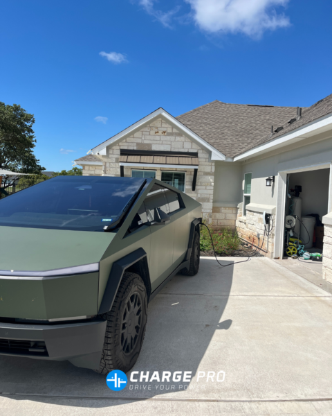 Tesla Cybertruck charging at a home Level 2 EV charger installation outside a garage in Austin, Texas by ChargePro Texas